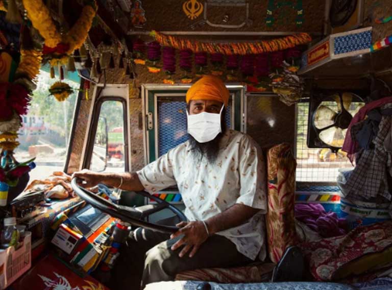 Sikh truck driver with mask