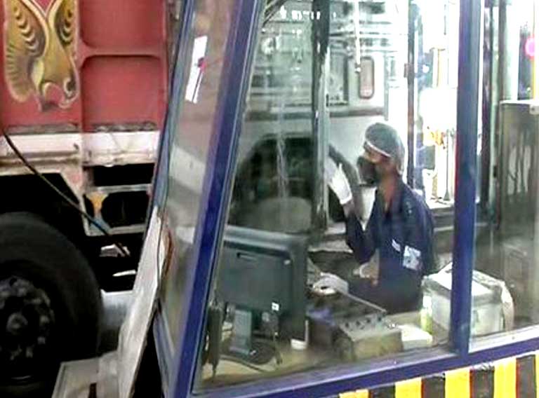 Toll Plaza employee wearing mask