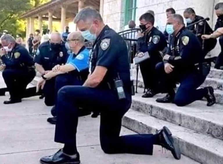 The police kneels down in remorse